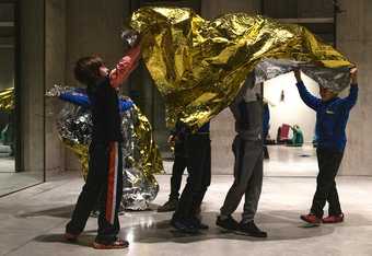 A group students explore materials in the Tanks at Tate Modern