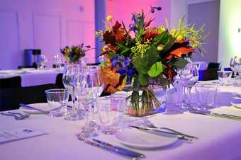 A table set with a bouquet of flowers.