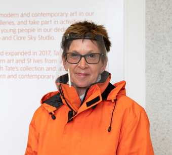 a member of Tate's visiting staff waves